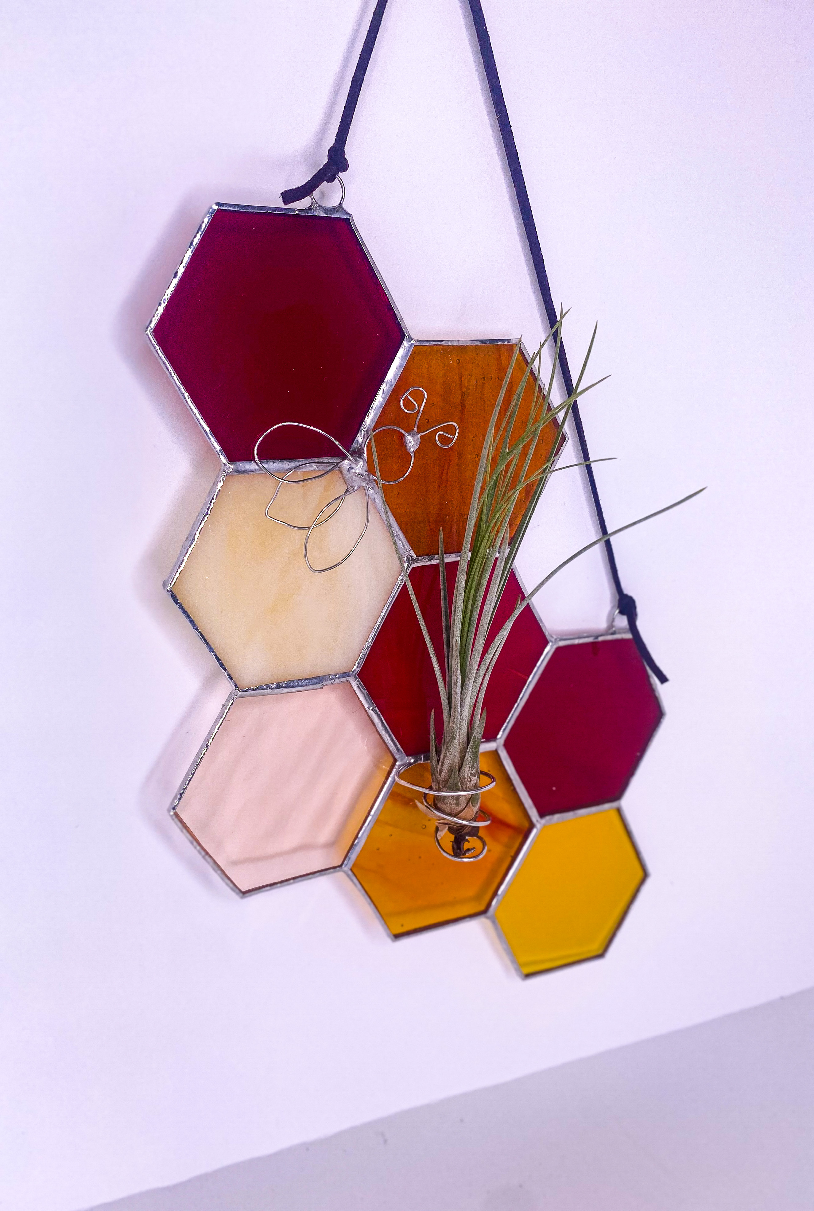 Honeycomb hexagon suncatcher in amber, burgundy and pink glass