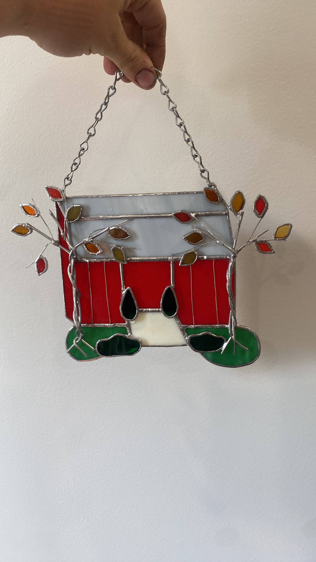 Stained glass red barn with autumn leaves