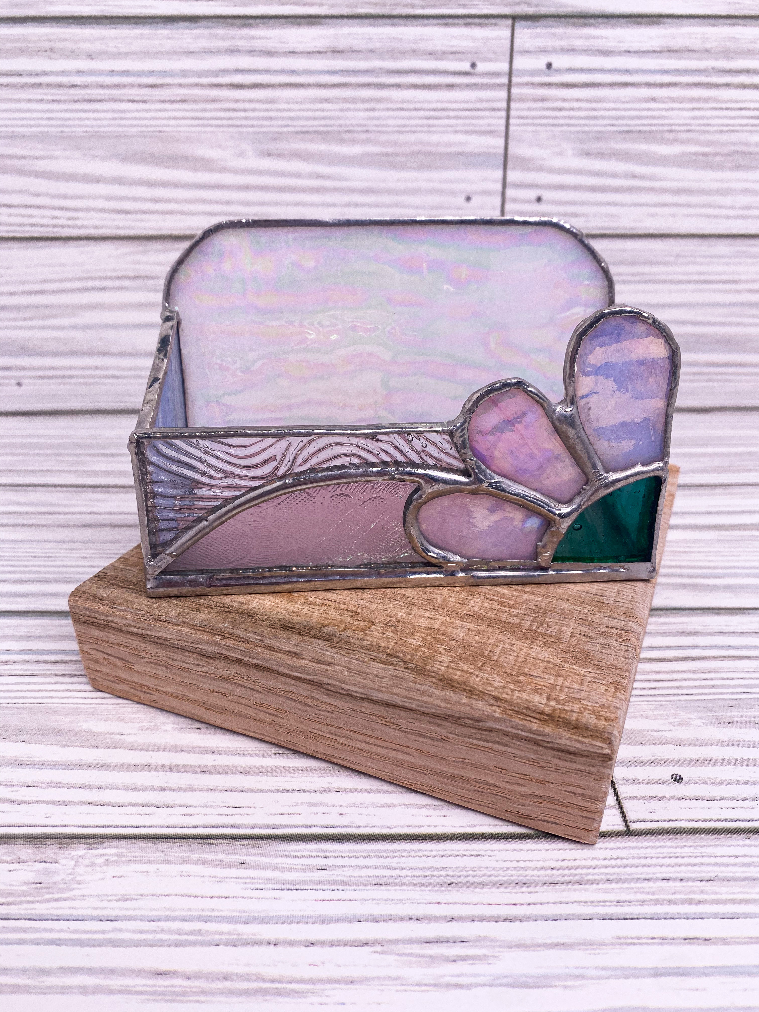 Iridescent stained glass business card holder on a wood base