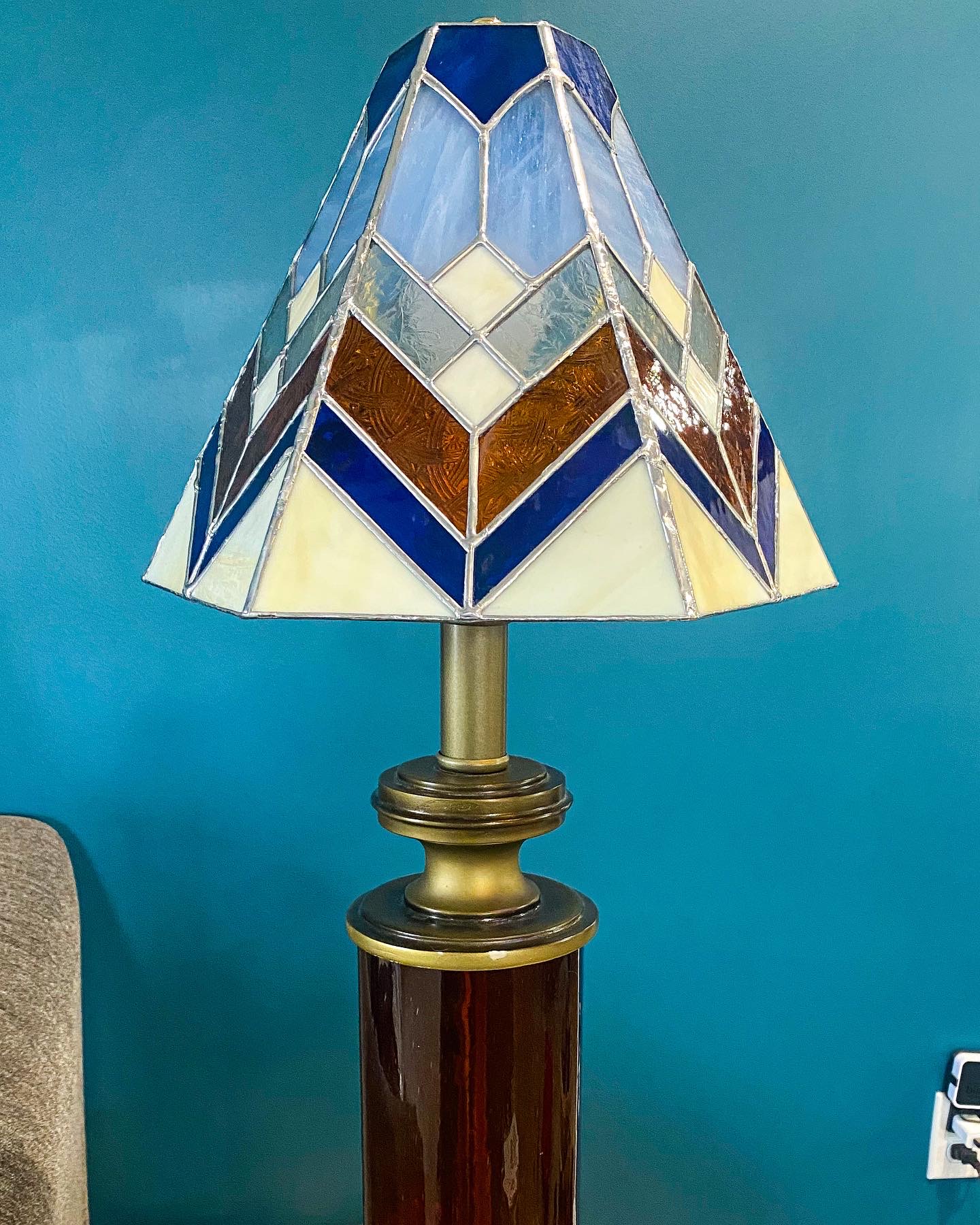 Tiffany-style stained glass lampshade in blue and amber