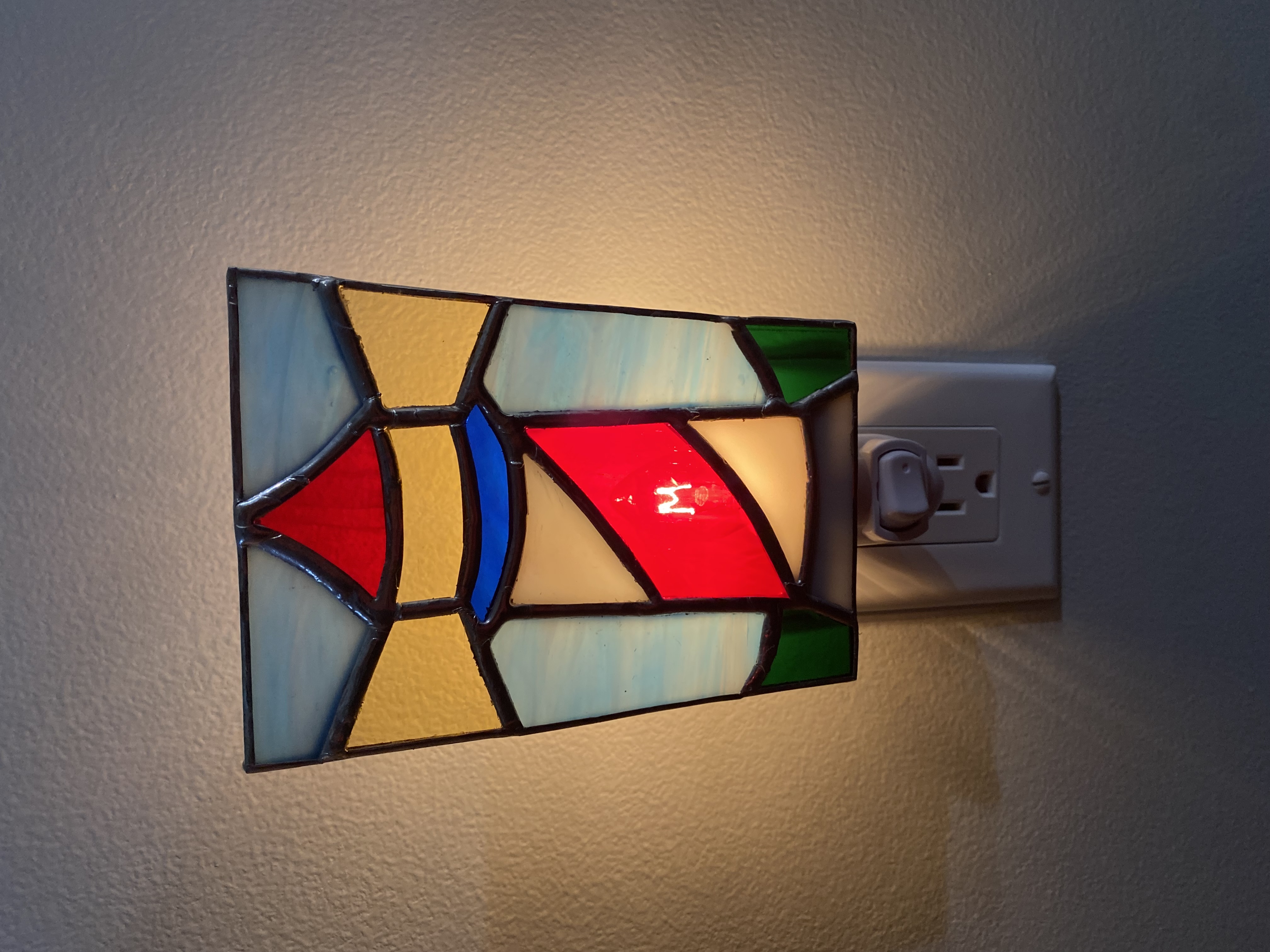 Lit stained glass lighthouse night light